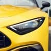 Mercedes yellow car with protective PPF kit for enhanced gloss and protection.