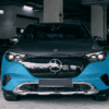 EQE SUV with protective film kit on front bumper in indoor parking.