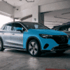 Mercedes EQE SUV with full front and half protection film kit in parking garage.