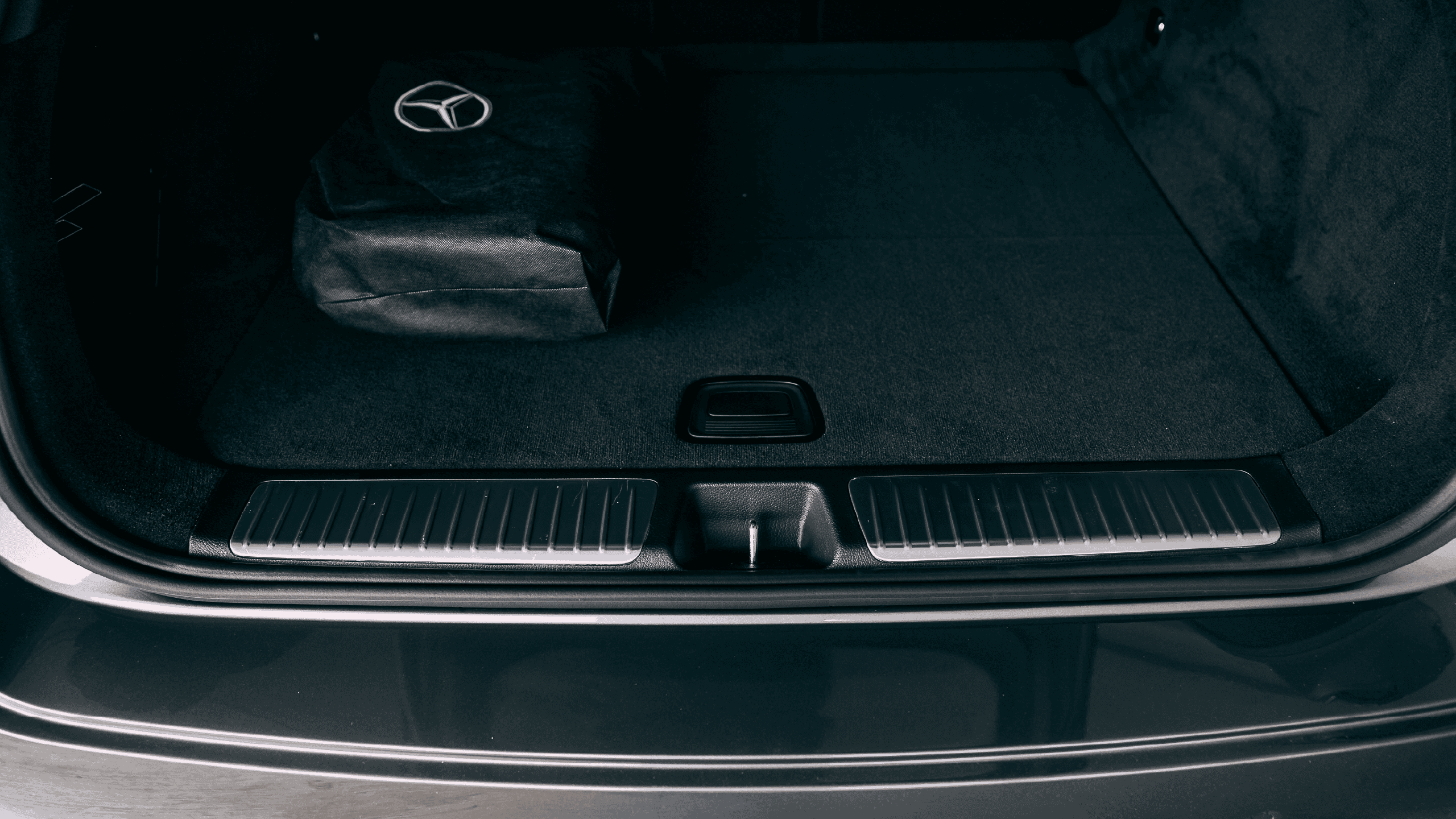 Protective film applied to EQE SUV luggage space for scratch resistance and durability.